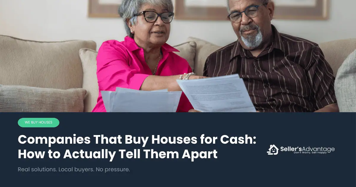 Senior couple sitting together on a couch, reviewing paperwork with calm expressions